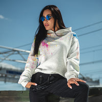 Woman in light grey hoodie and neon print