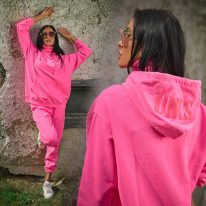 Woman in pink track suit set